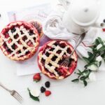 A simple syrup infused with the flavor of fresh mint sweetens this strawberry ice cream.