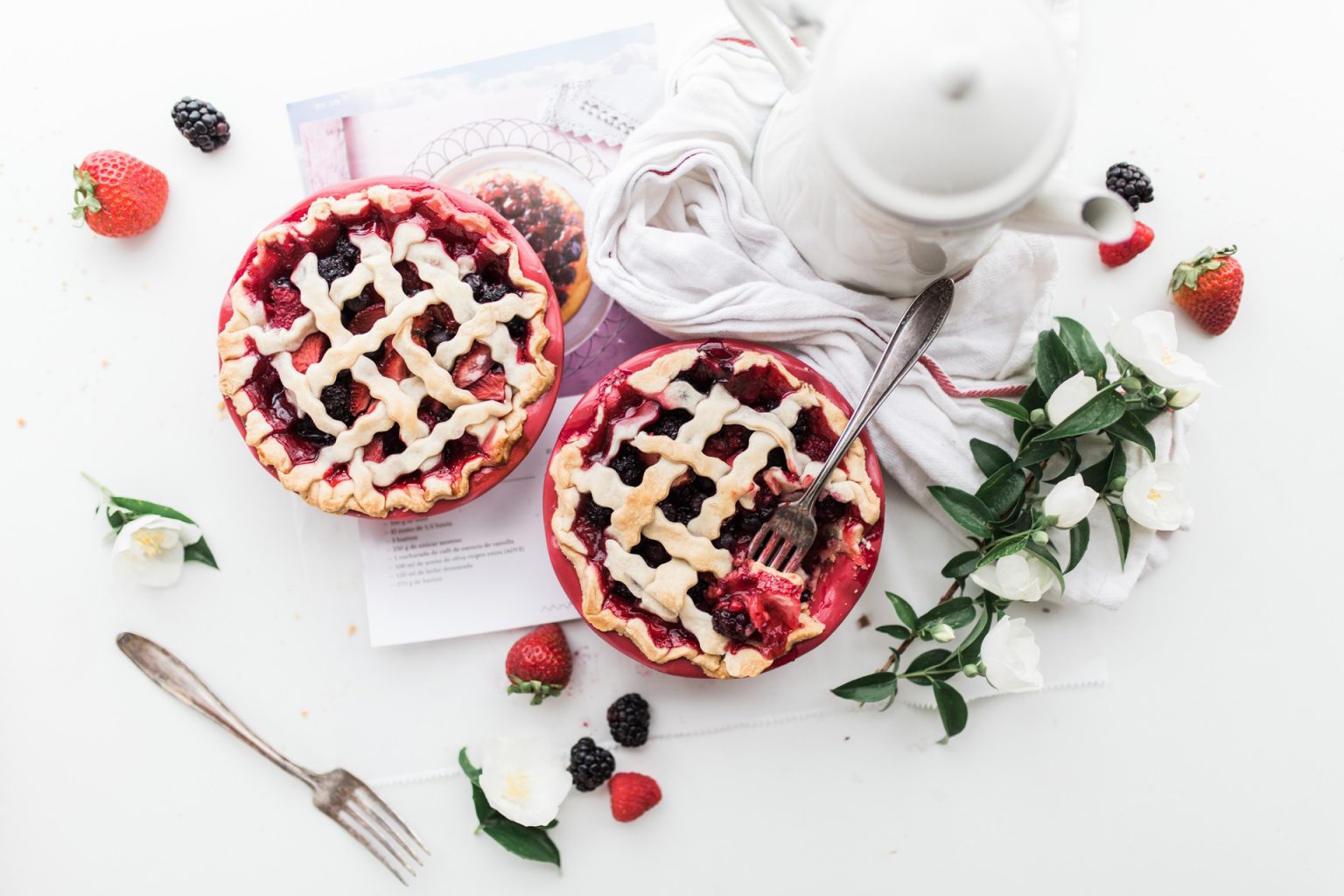 A simple syrup infused with the flavor of fresh mint sweetens this strawberry ice cream.